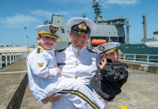 LTCDR Ryan Hissong returns from deployment, with his son and daughter Finn and Isla.