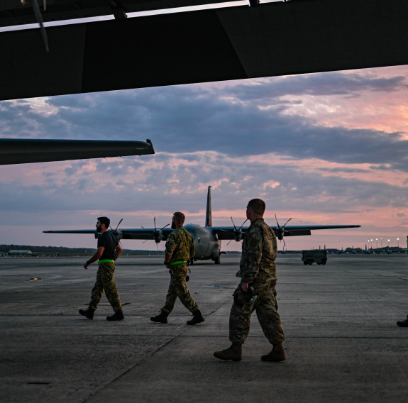 Members of the 19th Airlift Wing and Royal New Zealand Air Force aviators walk to a C-130J Super Hercules at Little Rock Air Force Base, Arkansas, Oct. 26, 2023. 