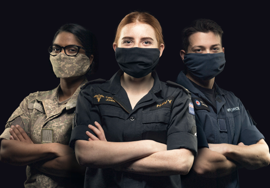 NZDF personnel with masks on and arms crossed.