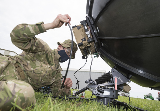 A New Zealand Army signallers setup a radio dish to establish communications