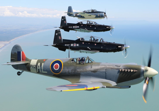 Past and present: Air Force Heritage Flight aircraft the Spitfire (bottom of photo) and Avenger (top) flying in formation with Texans from the Central Flying School at Ohakea