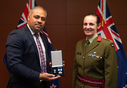 Brigadier Rose King receives the NATO Meritorious Service Medal at a ceremony at Parliament with Minister of Defence Peeni Henare