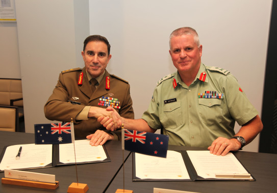 New Zealand Chief of Army Major General John Boswell (right) and Australian Chief of Army Lieutenant General Simon Stuart signing Plan Anzac in Wellington, reinvigorating longstanding cooperation between the two armies.