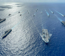 A fleet of Navy ships on the ocean