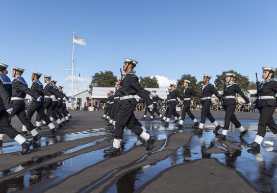 Officers and recruits march in formation on the parade ground during a graduation parade 