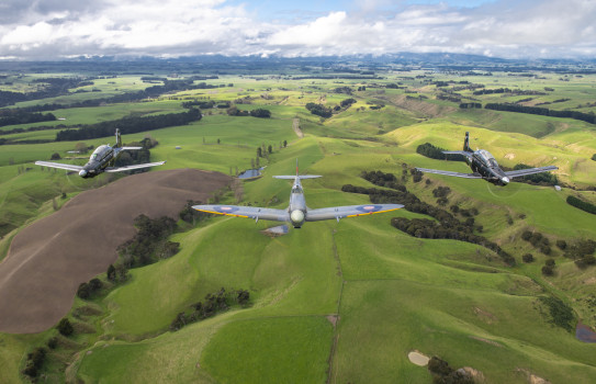 Heritage Flight Texans and the Spitfire perform a flypast to commemorate Anzac Day across Manawatu and Whanganui in 2022