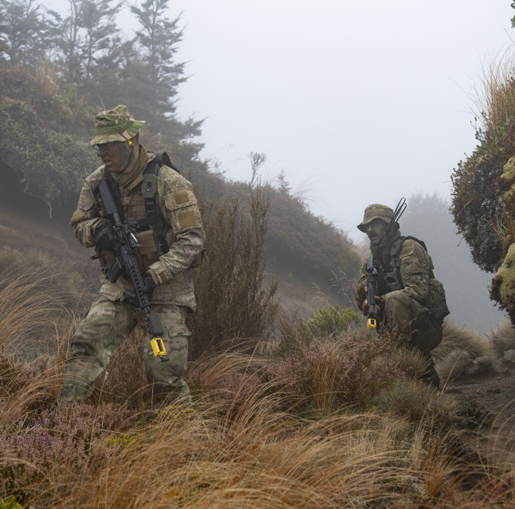 Infantry soldiers advancing on a position held by hostile forces
