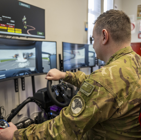 Two aviators operate the programme CPL Daly has developed using a gaming chair, steering wheel set and curved screens.