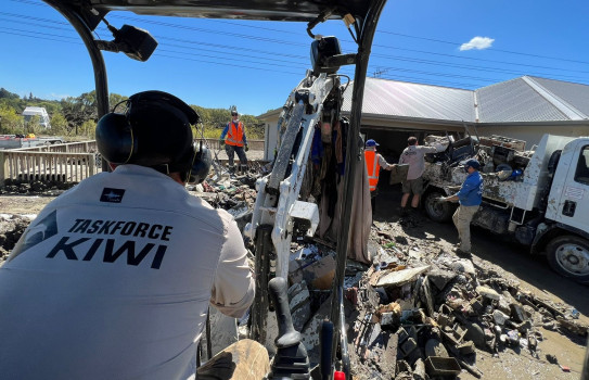 Taskforce Kiwi members clear debris following Cyclone Gabrielle in at Waiohiki in Hawke’s Bay in 2023