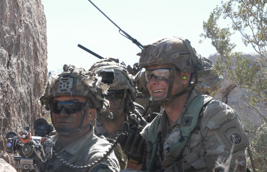 82nd Airborne Division Paratroopers stack behind a wall outside a Military Operations on Urban Terrain village as part of an urban assault experiment conducted by the 82nd Airborne and Joint Forces during Project Convergence - Capstone 4 at Fort Irwin, Ca