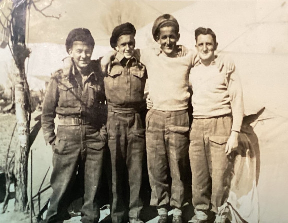 Sepia photo of four young people.