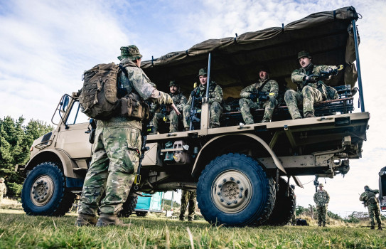 Lance Corporal Gilbert gives fellow Reserve Force soldiers a lesson in disembarking a vehicle