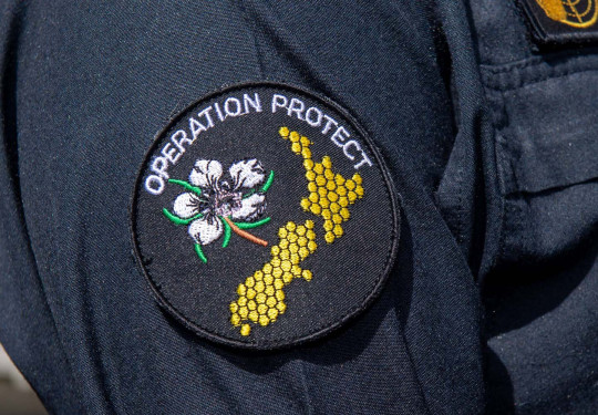The Operation Protect patch, worn on a uniform