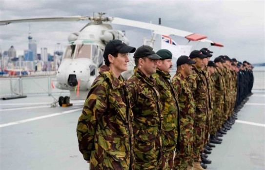 Captain Fraser, far left, parading aboard HMNZS Canterbury, headed to Tonga and Samoa after the 2009 tsunami